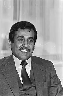 Photograph of a man in suit and tie