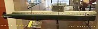 The world's first nuclear submarine, the USS Nautilus (SSN-571) of 1954, shows a very clean stern section, while the bow is clearly to some extent inspired by the Type XXI. Her test depth of 210&nbsp;m was comparable to the German boat, but at 23&nbsp;kn (43&nbsp;km/h) submerged she was faster by far, even faster than any previous US fleet boat had been on the surface. Unfortunately, serious design flaws in her bow and sail resulted in extreme vibrations at high speed, and worsened over time. At the end of her life 4&nbsp;kn (7&nbsp;km/h) was enough to deafen her sonar, and the noise drastically increased the risk of detection.