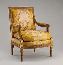 Louis XVI style armchair (fauteuil) from Louis XVI's Salon des Jeux at Saint Cloud; 1788; carved and gilded walnut, gold brocaded silk (not original); overall: 100 × 74.9 × 65.1&nbsp;cm; Metropolitan Museum of Art