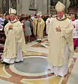 Bishop Malvestiti, just ordained, blessing the people. Behind him, bishops Beschi, left, and Merisi, right.