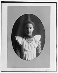 A young woman facing the camera
