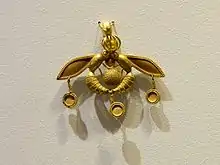 The Bee Pendant, an iconic Minoan jewel; 1700–1600 BC; gold; width: 4.6 centimetres (1.8&nbsp;in); from Chrysolakkos (gold pit) complex at Malia; Archaeological Museum of Heraklion (Heraklion, Greece)