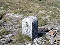 Border stone at Passo San Giacomo between Val Formazza in Italy and Val Bedretto&nbsp;[it] in Switzerland
