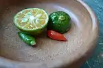 Labuyo chilis and calamansi are mixed with soy sauce, vinegar, and/or fish sauce at the diner's preference to create a dipping sauce (sawsawan)