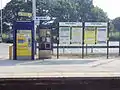 The ticket machine and information boards.