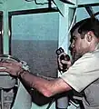Photographs of Captain A.G.B. Grosvenor, executive officer of the USS Kitty Hawk (CV-63) from its Western Pacific Cruise Yearbook of 1970–1971, page 12.