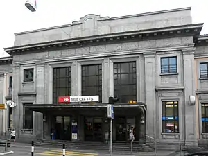 Grand entrance with two-story windows