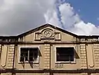 A colonial era building with the Om symbol (1930)