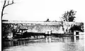 The captain jumped off the boat before the wall went out, dumping the boat into the creek below. There were no casualties in this accident.