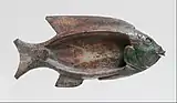 Cosmetic dish in the shape of a tilapia fish; 1479–1425&nbsp;BC; glazed steatite; 8.6 × 18.1&nbsp;cm (3.4 × 7.1&nbsp;in); Metropolitan Museum of Art