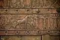 Detail of an embossed scene on bronze plate showing Shalmaneser III in a chariot and Assyrian archers. From a Balawat gate, Iraq, 859-824 BCE. Ancient Orient Museum, Istanbul