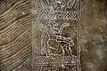 Detail of the embroidered dress of an Apkallu, showing a kneeling winged eagle-headed Apkallu. From Nimrud, Iraq. 883-859 BC. Ancient Orient Museum, Istanbul