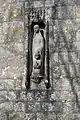 Carving on the south face of the tower of St Nicholas church in Durweston, Dorset, by Don Potter (1991)