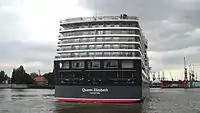 With the help of harbour pilots, its Azipod propulsion, and stern thrusters, the ship moves into the correct position.