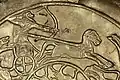 Hunter controlling his chariot from the waist, Ugarit, 15th-14th century BCE.