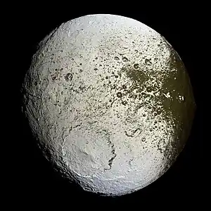 Image 23IapetusPhoto credit: Cassini orbiterFalse-color mosaic shows the entire hemisphere of Iapetus (1,468 km or 912 mi across) visible from the Cassini orbiter on the outbound leg of its encounter with the two-toned moon of Saturn in September 2007. The central longitude of the trailing hemisphere is 24 degrees to the left of the image's center. It is hypothesized that the moon's two-toned nature is due to the sublimation of various ices evaporated from the warmer parts of the surface.More selected pictures