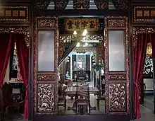 Image 138Inside the former house of a Peranakan (Baba-Nyonya or 峇峇娘惹) in Malacca which has now been converted into a museum, a Nyonya can be seen sitting inside wearing the traditional kebaya. (from Malaysian Chinese)
