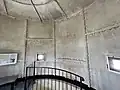 Interior view of Gibbs Hill Lighthouse showing the cast iron plates of the outer wall.