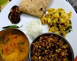 Jeera Aloo served with sprouts and dal.