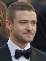 A profile picture of young blonde man who is looking forward