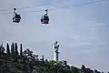 Statue with cable cars in the foreground