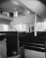 Main meeting room, prior to relocation. The offices in the balcony were built for AFSC.