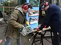 Using a circular saw to prepare an information panel