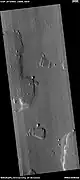 Wide view of various shapes created by erosion, as seen by HiRISE under HiWish program.  NASA named this the HiRISE Picture of the Day for July 31, 2023.