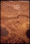 Patterned ground in Alaska.  The center is lower; hence full of water.  This scene is like low-center polygons on Mars—but with water.