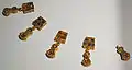 Five of the necklace pendants (one slightly damaged) (GNM)