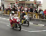 Giacomo Agostini (9) MV Agusta 500c&nbsp;John McGuinness 500cc Honda - Classic TT Parliament Square, Ramsey 24 August 2013