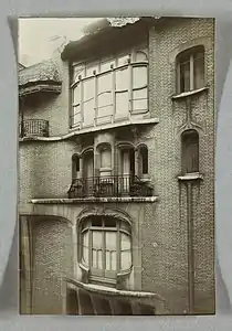Early photo of the main facade, with original windows