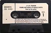 Black cassette tape with white label