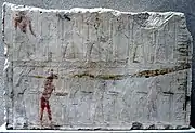 Photograph of personages in a relief