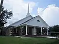Renovated First Baptist Church (2010 photo); FBC celebrated its 75th anniversary on August 22, 2010; pastor Warren J. Hoffman (September 2013)