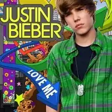 A teenage male stands in front of a colourful animated background.