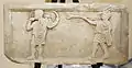 Roman cornu (left) and tuba (right) in a relief from the Museo Ostiense, Ostia Antica, Italy.