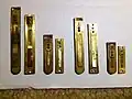Note that these are German harmonium reeds that have yet to have the holes and notch drilled.  They are simply stamped 'Made in Germany' with no other brand indication. Notice the size differences between the German reeds and Indian reeds of the same pitch. The casing sizes are not retrofit between German and Indian reeds.
