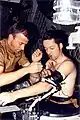 Weitz assists Kerwin with a blood pressure cuff