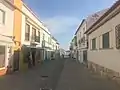 Colorful buildings line the quiet streets