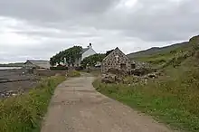The c.1770 Catholic chapel of St Columba. A post office whilst St Edwards operated. Now once again a church