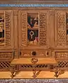 Various cabinets, doors open or ajar, filled with objects of note.