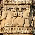 Indians riding horses.