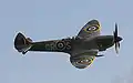 Supermarine Spitfire with 20&nbsp;mm cannon protruding from the leading edge of the wing