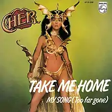 A woman dressed in a Viking warrior resemblant outfit, a winged bikini bottom, wings and a gold scabbard attached to her hip.