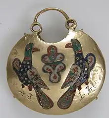Front of a temple pendant with two birds flanking a tree of life; 11th–12th century; cloisonné enamel & gold; overall: 5.4 by 4.8 by 1.5 centimetres (2.13&nbsp;in ×&nbsp;1.89&nbsp;in ×&nbsp;0.59&nbsp;in); made in Kyiv (Ukraine); Metropolitan Museum of Art (New York City)