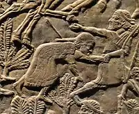 Teumman wounded and led by his son Tammaritu, trying to escape from the battlefield at Ulai.