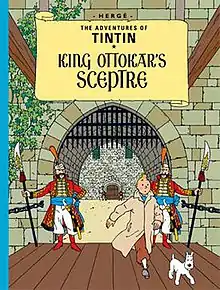 Tintin and Snowy are walking towards us, through the gates of a royal castle.