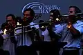 The Municipal Band's trombone section being featured at a Fourth of July celebration