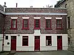Former almshouses on the west of the court yard (rebuilt 1787)